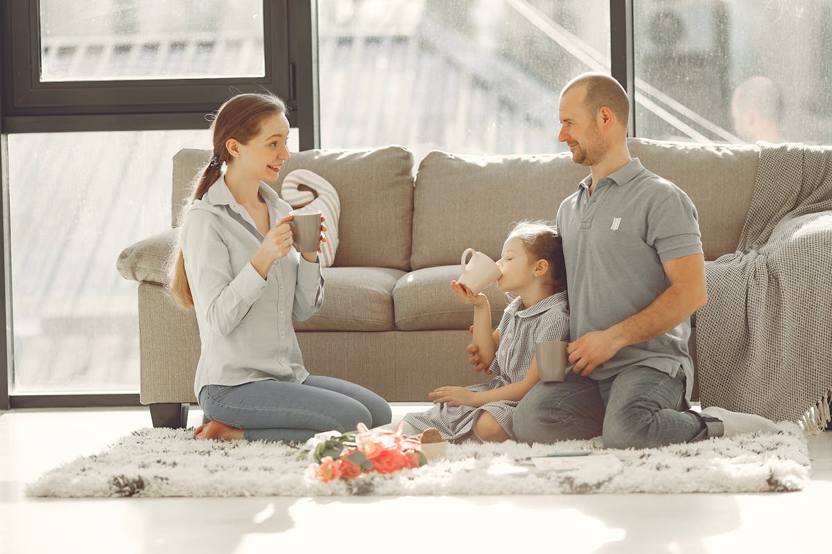 Family relaxing comfortably in their air-conditioned Katy home